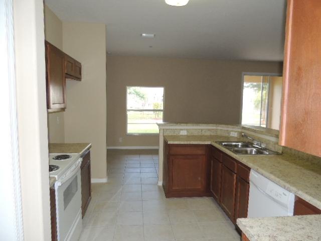 1109 Southwest Kickaboo Road Port St. Lucie, FL 34953 - Photo 26 of 37 Kitchen_E