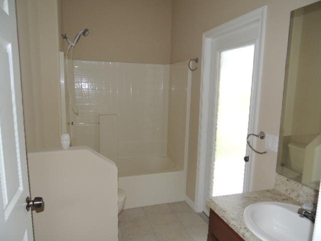 1109 Southwest Kickaboo Road Port St. Lucie, FL 34953 - Photo 3 of 37 BAth 3
