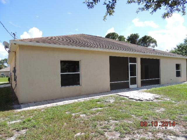 1109 Southwest Kickaboo Road Port St. Lucie, FL 34953 - Photo 36 of 37 Rear