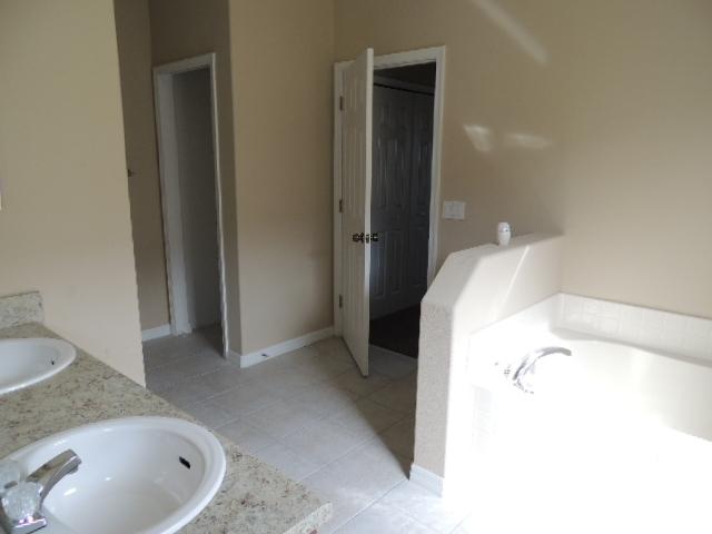 1109 Southwest Kickaboo Road Port St. Lucie, FL 34953 - Photo 4 of 37 BAth_Master (2)
