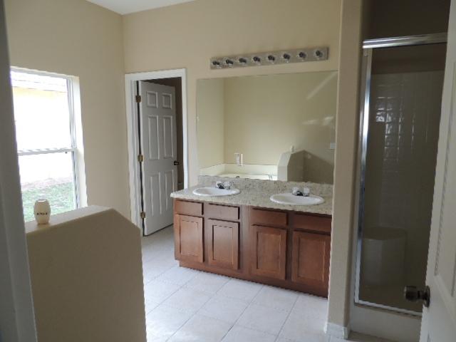 1109 Southwest Kickaboo Road Port St. Lucie, FL 34953 - Photo 5 of 37 Bath_Master