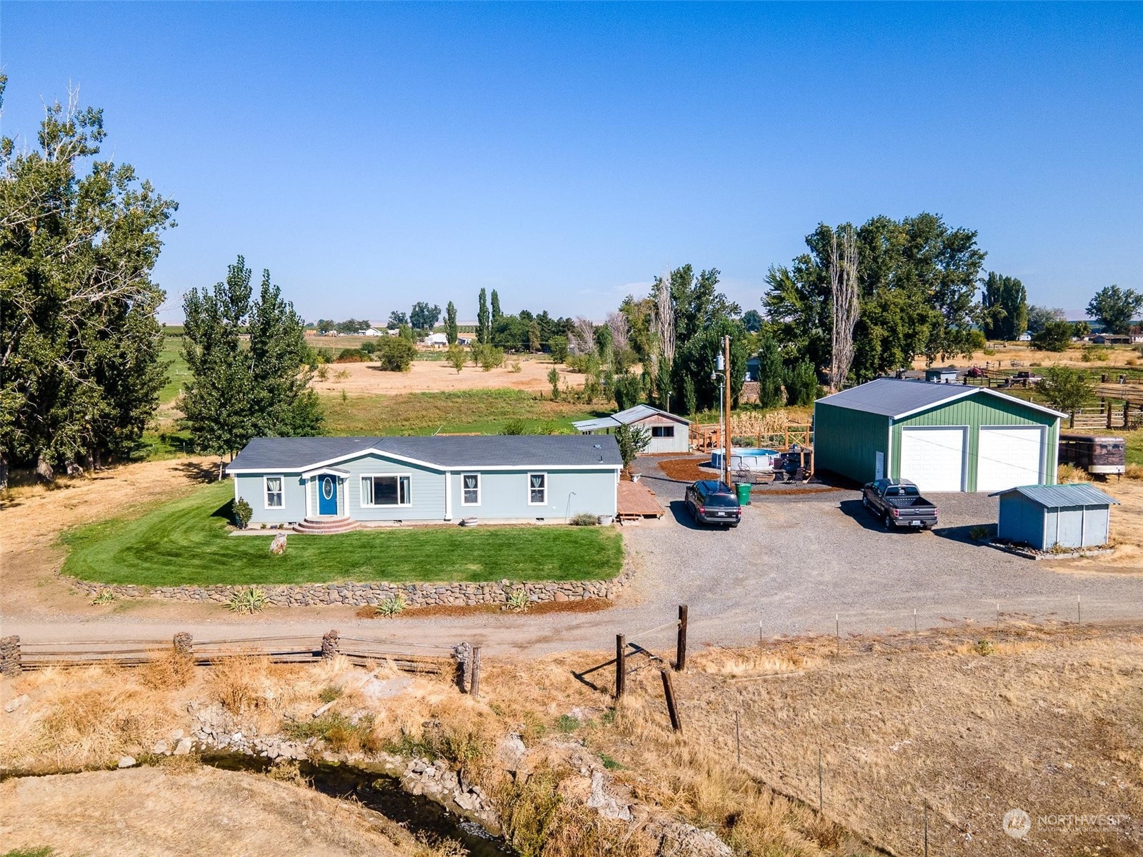 108108 West King Tull Road Prosser, WA 99350 - Photo 1 of 36 a view of a house with a yard patio and fire pit