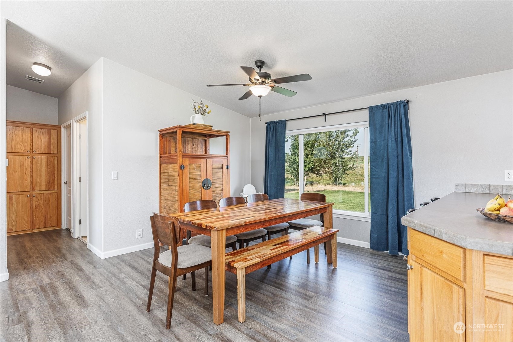 108108 West King Tull Road Prosser, WA 99350 - Photo 5 of 36 a view of a dining room with furniture window and wooden floor