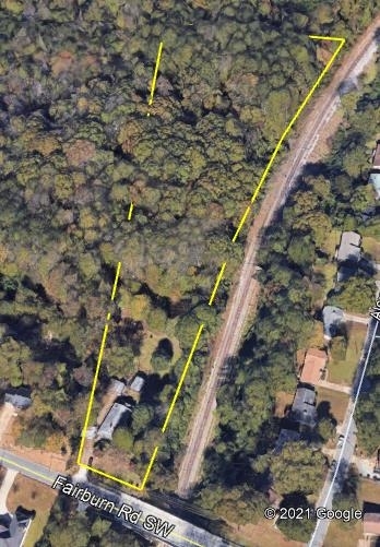 2890 Fairburn Road Southwest Atlanta, GA 30331 - Photo 1 of 1 a view of a yard with wooden fence