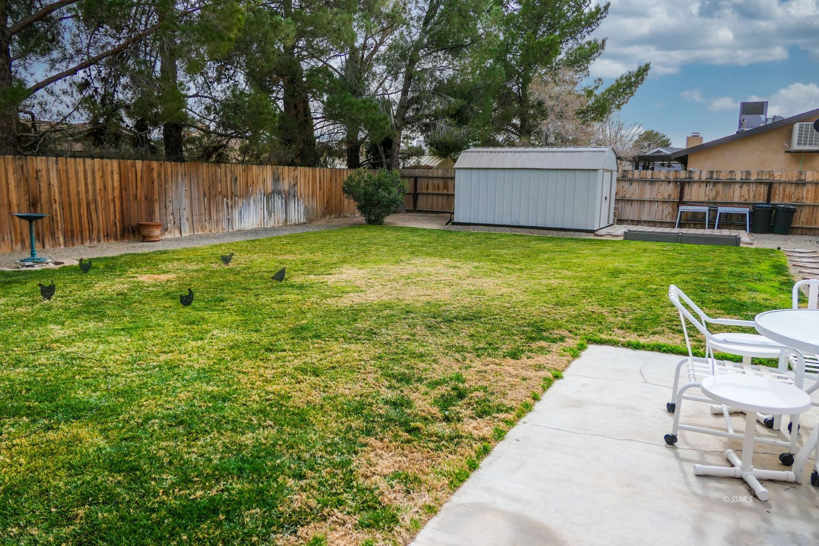 308 South Lilac Street Ridgecrest, CA 93555 - Photo 45 of 50 a view of a backyard with a small cabin