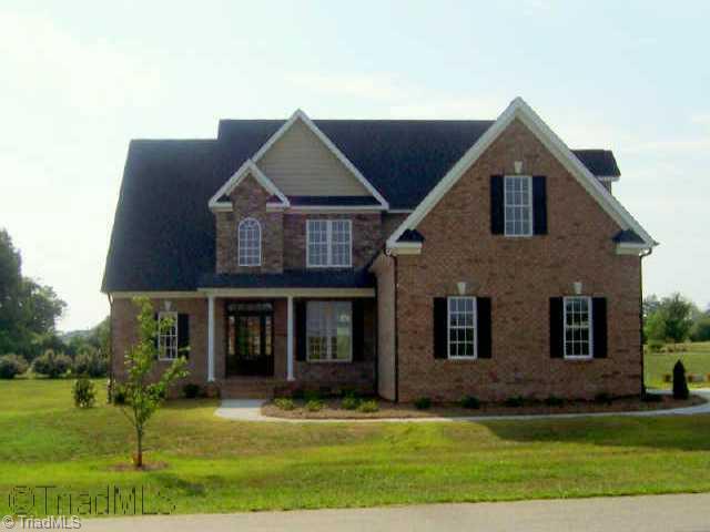 5627 Cape Fox Drive Oak Ridge, NC 27310 - Photo 1 of 9 Exterior Front.