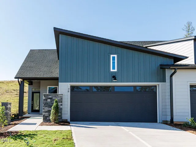 a view of outdoor space and front view of a house