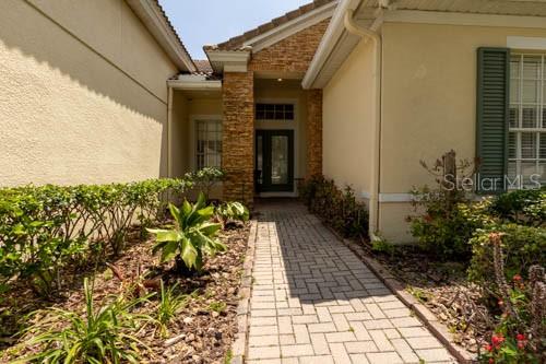 65 Calliope Street Ocoee, FL 34761 - Photo 2 of 60 a view of a pathway with flower pots