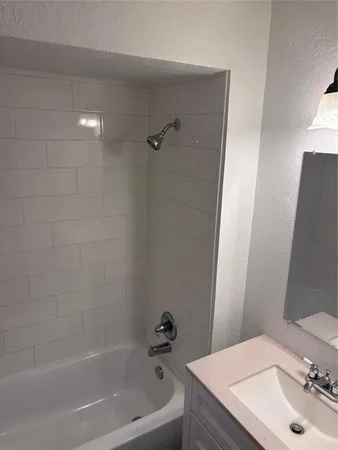 a bathroom with a sink and a bathtub