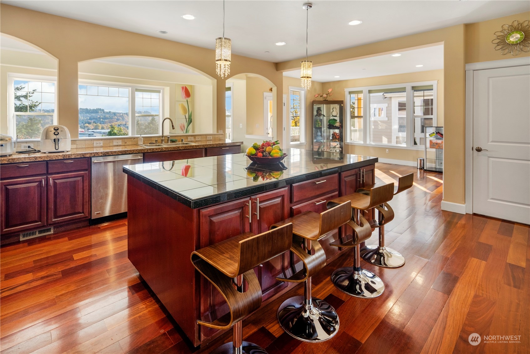 319 Maple Avenue Northwest Renton, WA 98057 - Photo 2 of 10 a large kitchen with a table and chairs