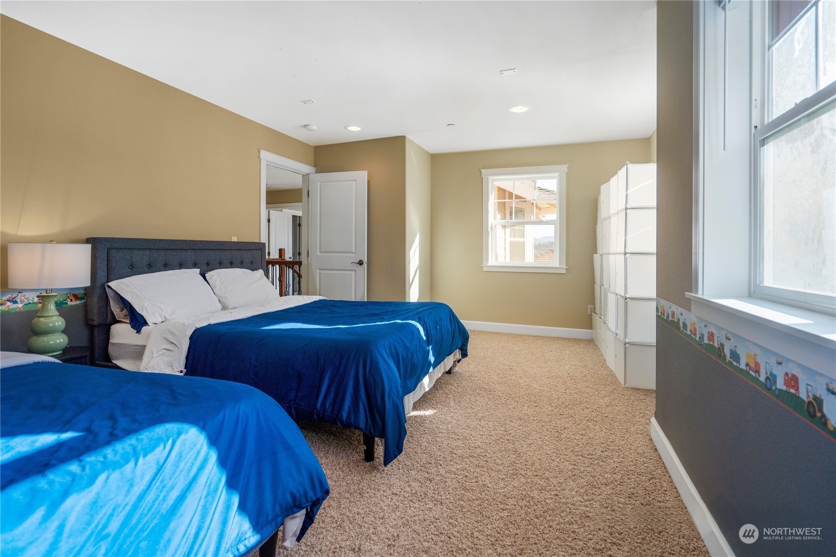 319 Maple Avenue Northwest Renton, WA 98057 - Photo 8 of 10 a bedroom with two beds and a large window