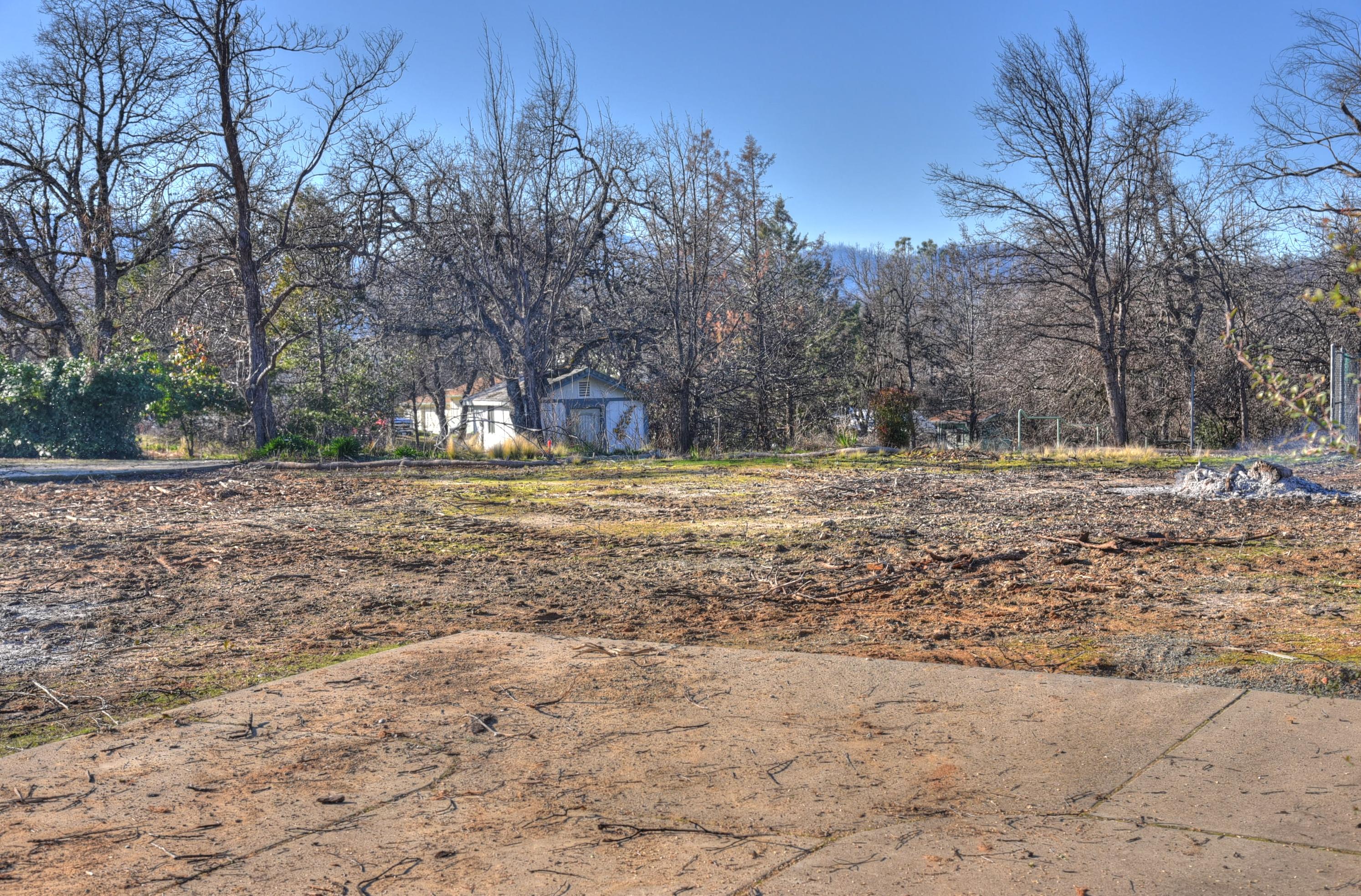 16244 Lower Springs Road Redding, CA 96001 - Photo 4 of 10 a backyard of a house with large trees