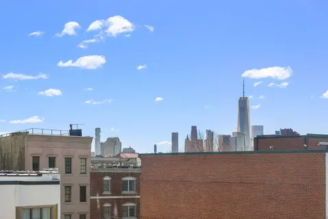 a view of a city with tall buildings