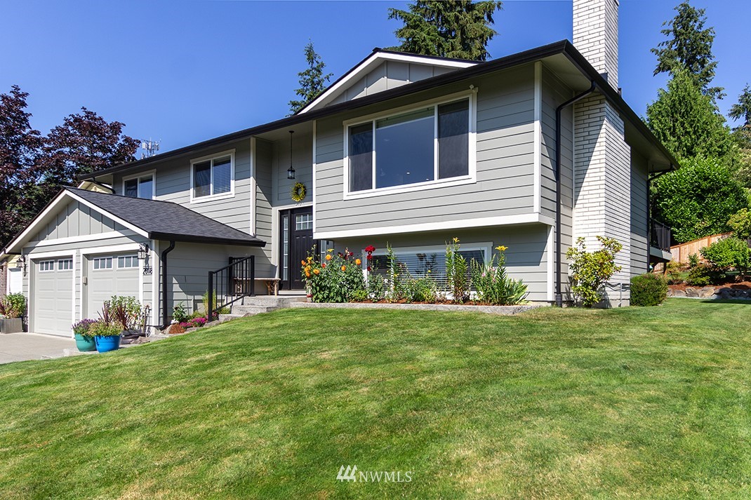20118 103rd Place Northeast Bothell, WA 98011 - Photo 2 of 40 a front view of a house with a yard and porch