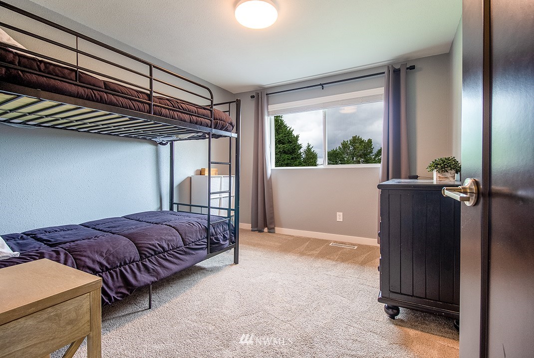 20118 103rd Place Northeast Bothell, WA 98011 - Photo 21 of 40 a bed room with a bed and a window