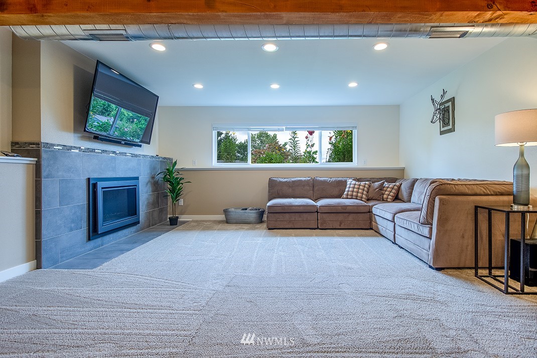 20118 103rd Place Northeast Bothell, WA 98011 - Photo 24 of 40 a living room with furniture and a flat screen tv