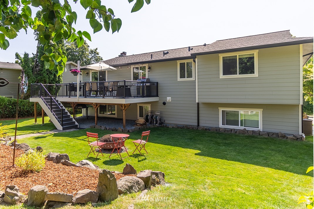 20118 103rd Place Northeast Bothell, WA 98011 - Photo 36 of 40 a view of a house with swimming pool and a yard