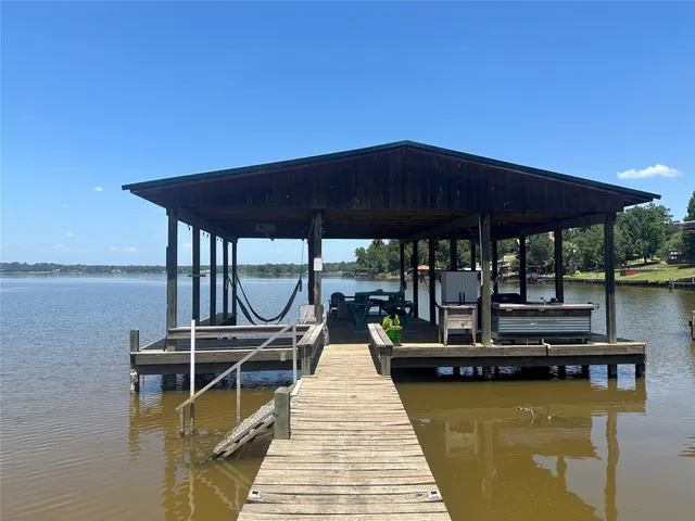 a view of swimming pool with chairs in patio