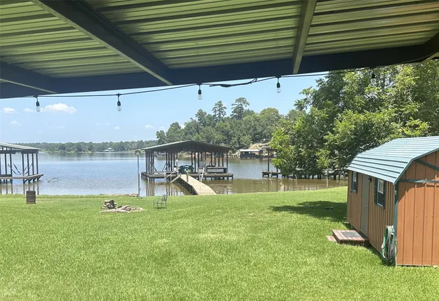 a view of a backyard with a garden and plants