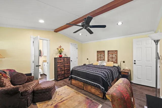 a bedroom with a bed and cabinets