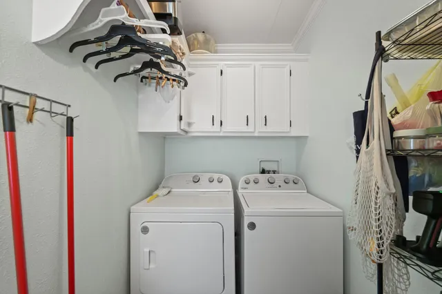 a view of storage and utility room with washer and dryer