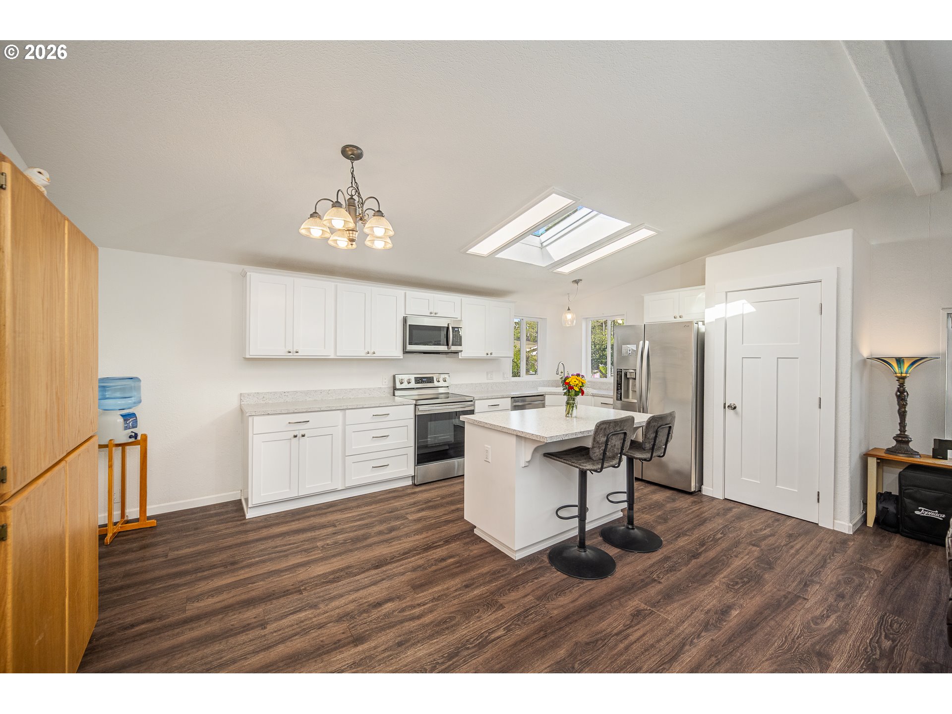 128 Evergreen Lane Florence, OR 97439 - Photo 11 of 34 a open kitchen with a sink cabinets and wooden floor