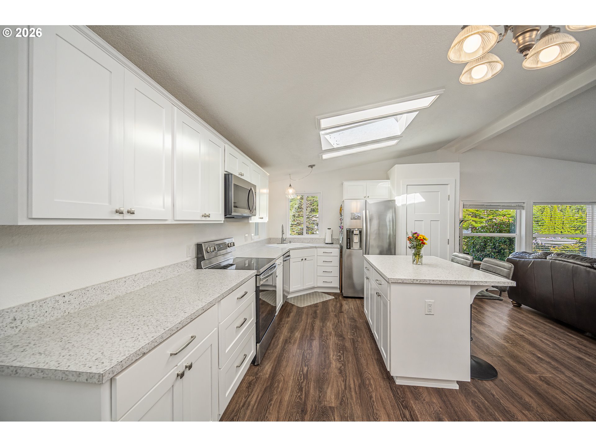 128 Evergreen Lane Florence, OR 97439 - Photo 13 of 34 a kitchen with a sink a counter top space stainless steel appliances and cabinets