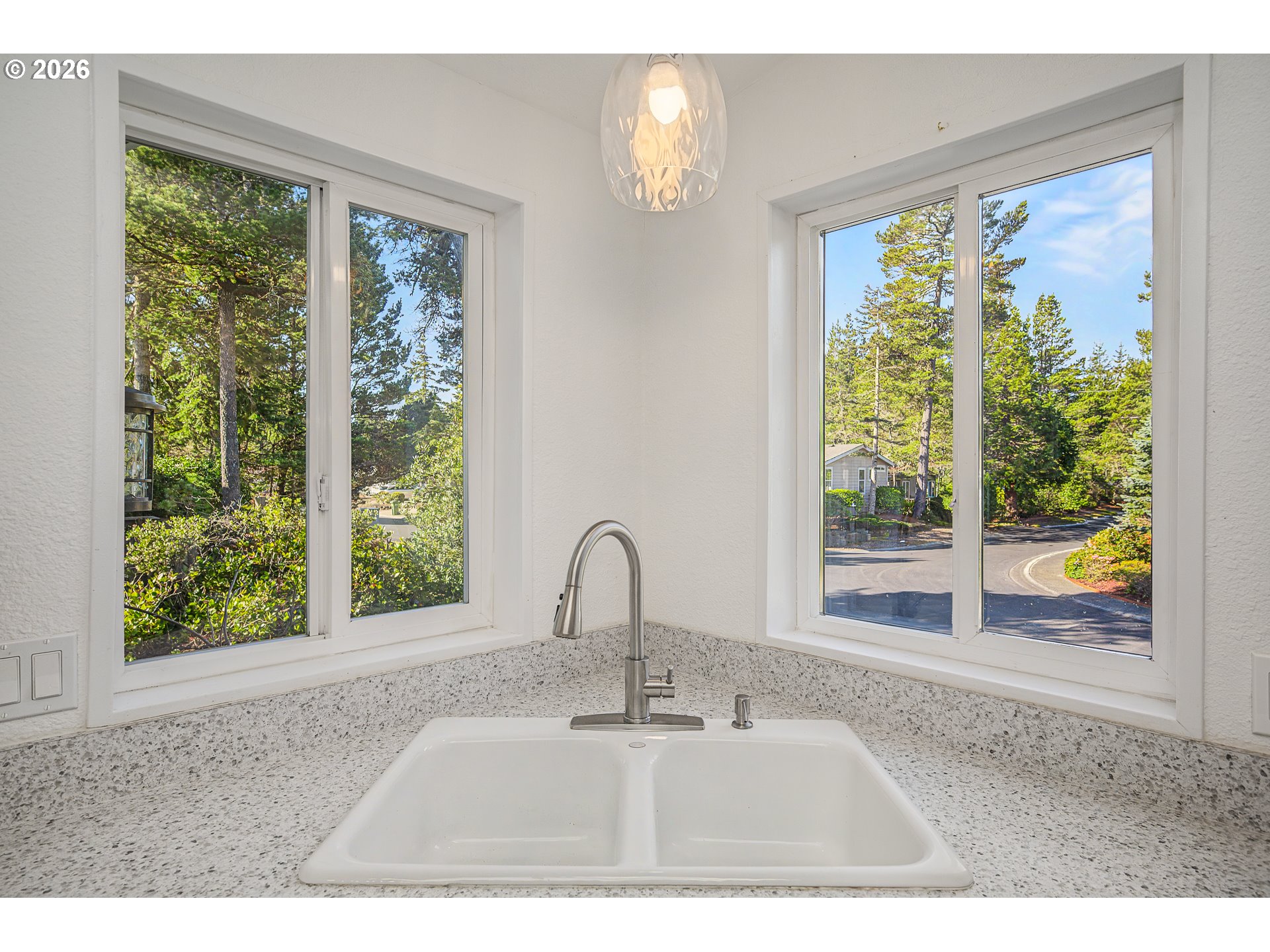 128 Evergreen Lane Florence, OR 97439 - Photo 14 of 34 a sink sitting in a bedroom next to a window