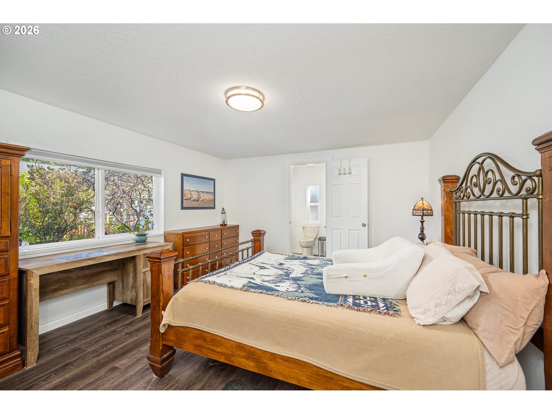 128 Evergreen Lane Florence, OR 97439 - Photo 17 of 34 a bedroom with a large bed and a table