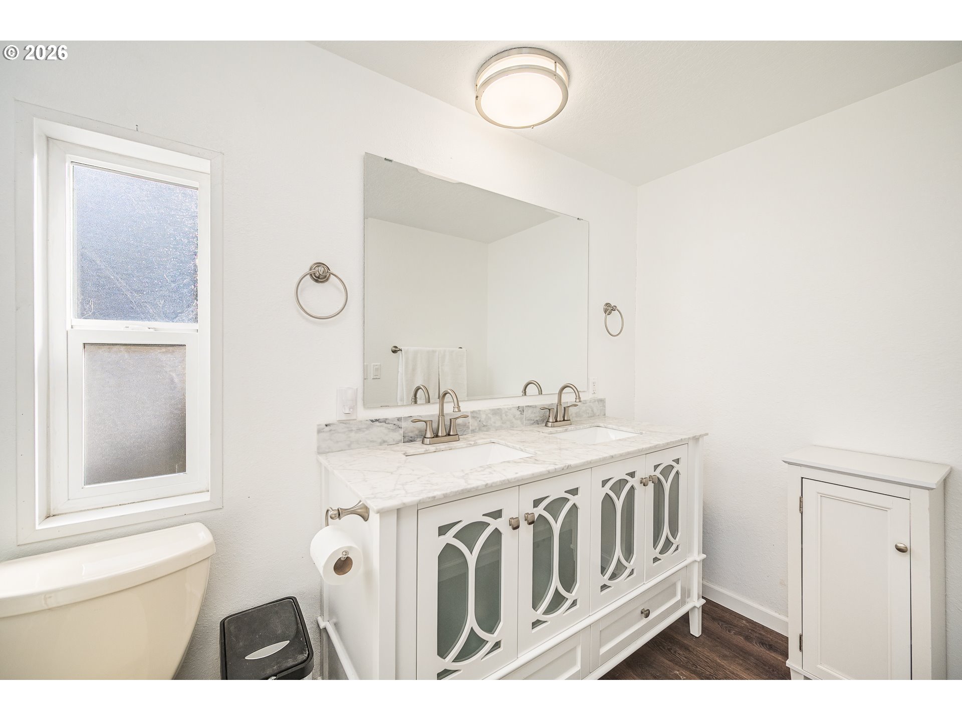 128 Evergreen Lane Florence, OR 97439 - Photo 19 of 34 a bathroom with a sink a mirror and a toilet