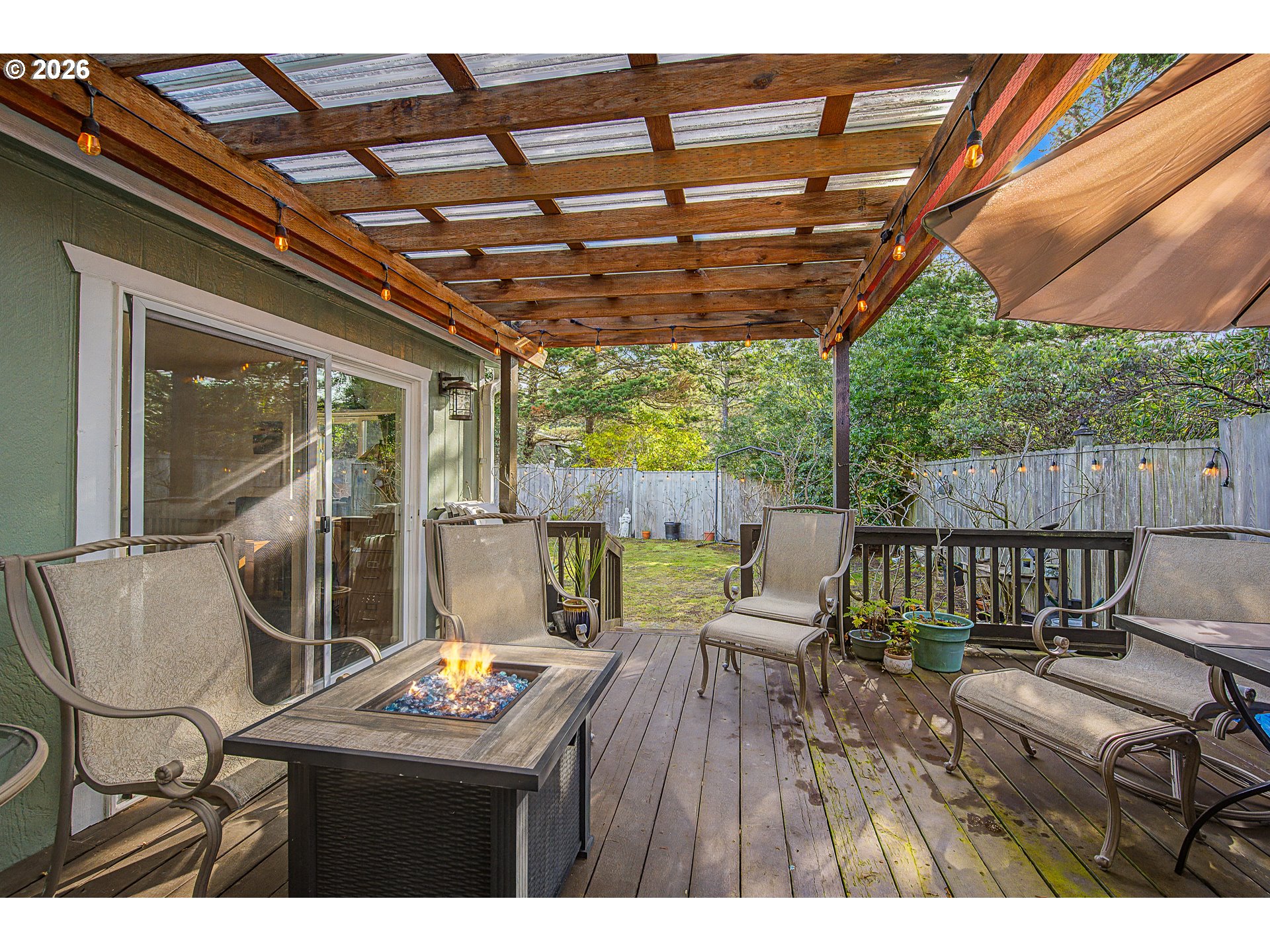 128 Evergreen Lane Florence, OR 97439 - Photo 25 of 34 a view of sitting area with furniture and wooden deck