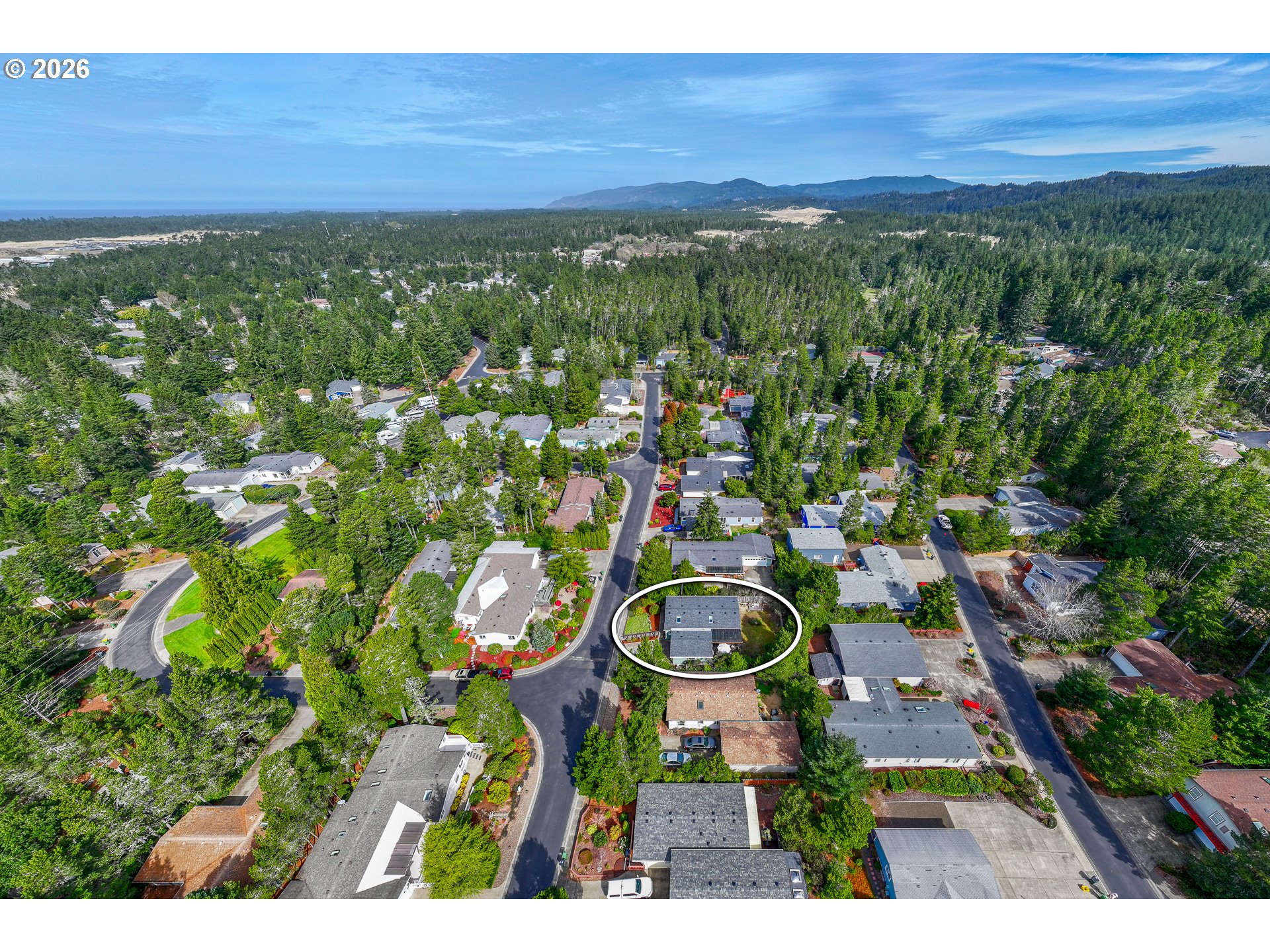 128 Evergreen Lane Florence, OR 97439 - Photo 31 of 34 a view of a city with lush green forest