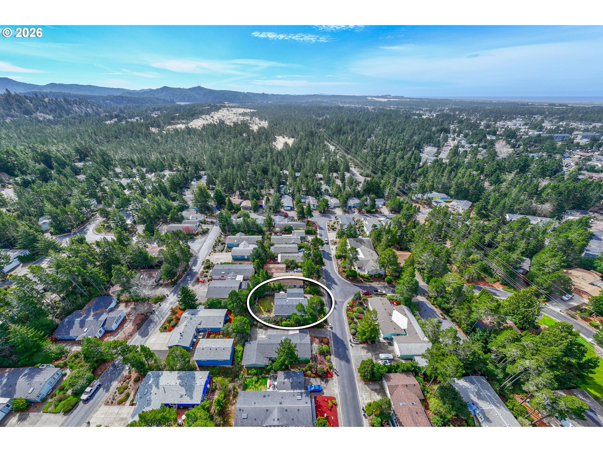 128 Evergreen Lane Florence, OR 97439 - Photo 33 of 34 a view of a city with lush green forest