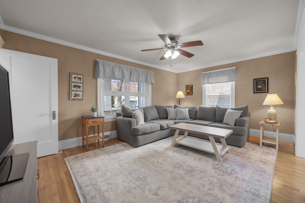 113 Bay State Road Worcester, MA 01606 - Photo 14 of 34 a living room with furniture a wooden floor and a window