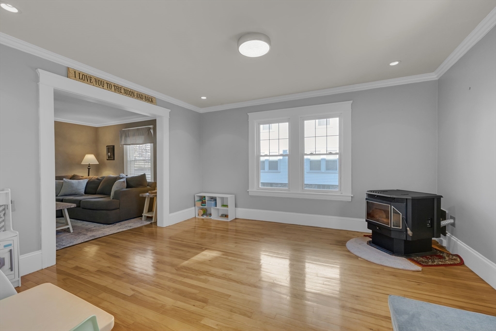 113 Bay State Road Worcester, MA 01606 - Photo 17 of 34 a bedroom with furniture and a wooden floor