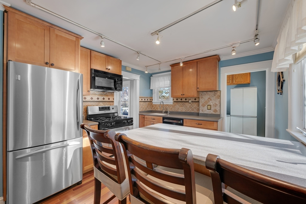113 Bay State Road Worcester, MA 01606 - Photo 20 of 34 a kitchen with stainless steel appliances a refrigerator and a stove top oven