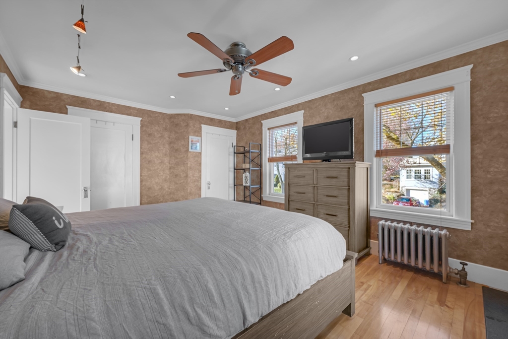 113 Bay State Road Worcester, MA 01606 - Photo 28 of 34 a bedroom with a bed and a flat screen tv