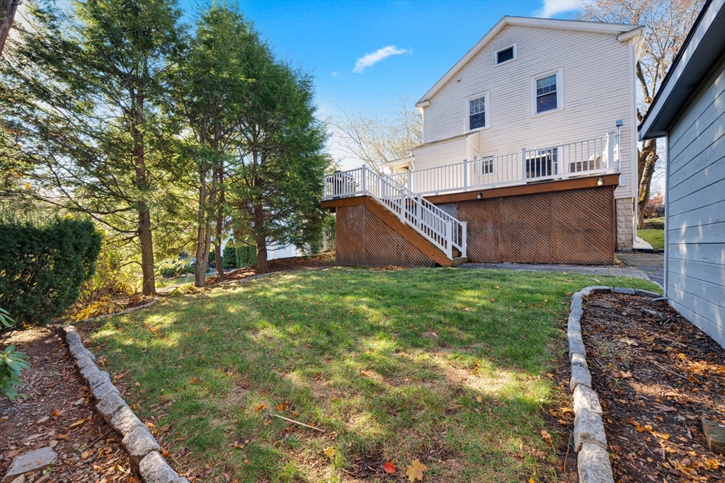 113 Bay State Road Worcester, MA 01606 - Photo 5 of 34 a view of a backyard with potted plants and large tree