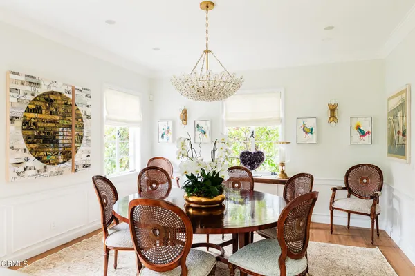 a view of a dining room with furniture window and outside view