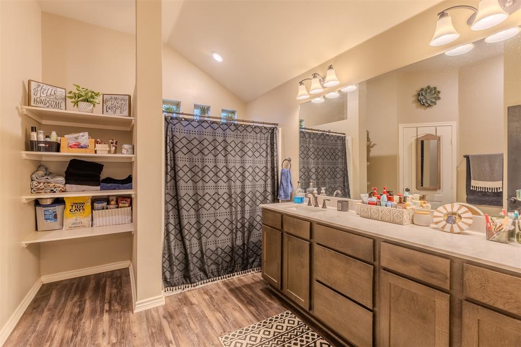 8676 State Highway Edgewood, TX 75117 - Photo 26 of 37 a bathroom with a sink and a mirror