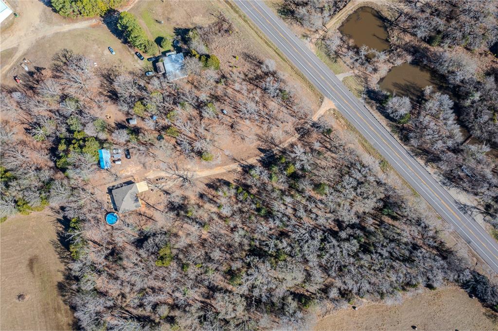 8676 State Highway Edgewood, TX 75117 - Photo 37 of 37 a view of a yard with a tree