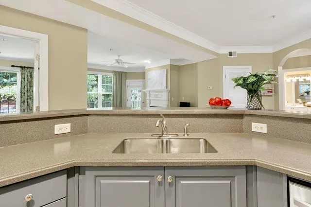 a kitchen with a sink and a window