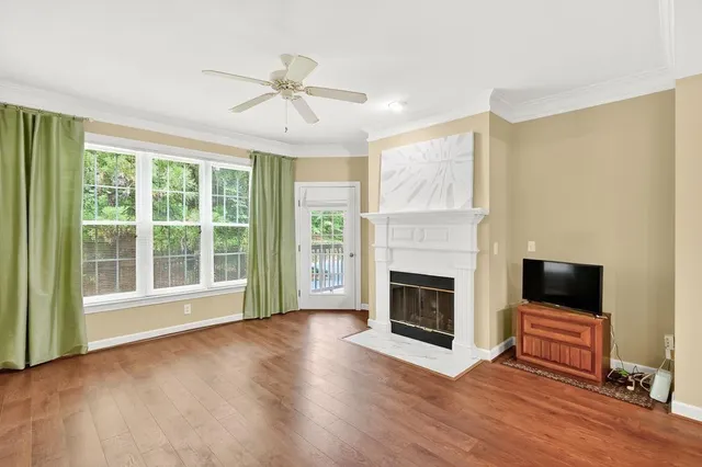 a view of livingroom with hardwood floor and fireplace