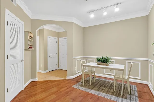 a workspace with wooden floor and a rug