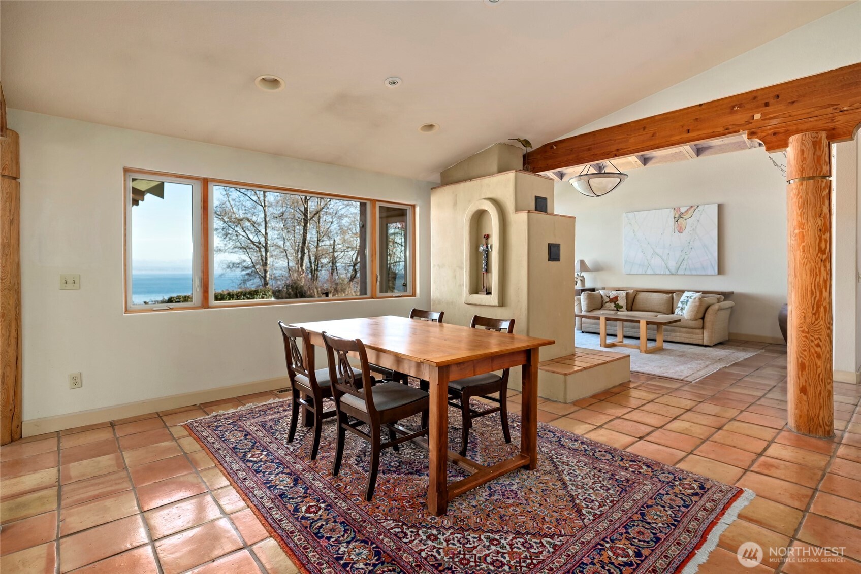 5477 Wilkinson Road Langley, WA 98260 - Photo 16 of 40 a view of a dining room with furniture window and wooden floor