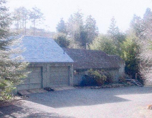 359 Nettleton Hollow Road Washington, CT 06793 - Photo 1 of 1 a view of a wooden house with a bench and trees