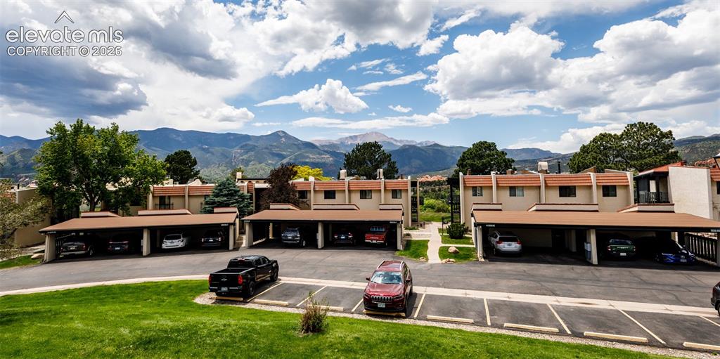 1034 Fontmore Road, Unit D Colorado Springs, CO 80904 - Photo 2 of 43 a front view of a house with a garden and trees