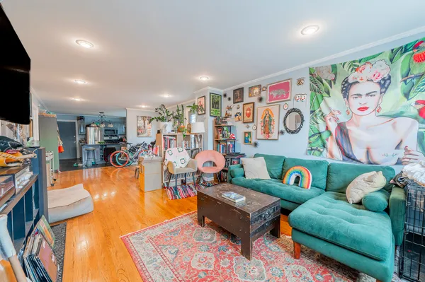 a living room with furniture and a flat screen tv