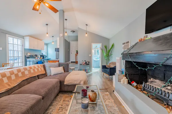 a living room with furniture and a fireplace