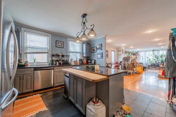 a kitchen with lots of counter top space and furniture